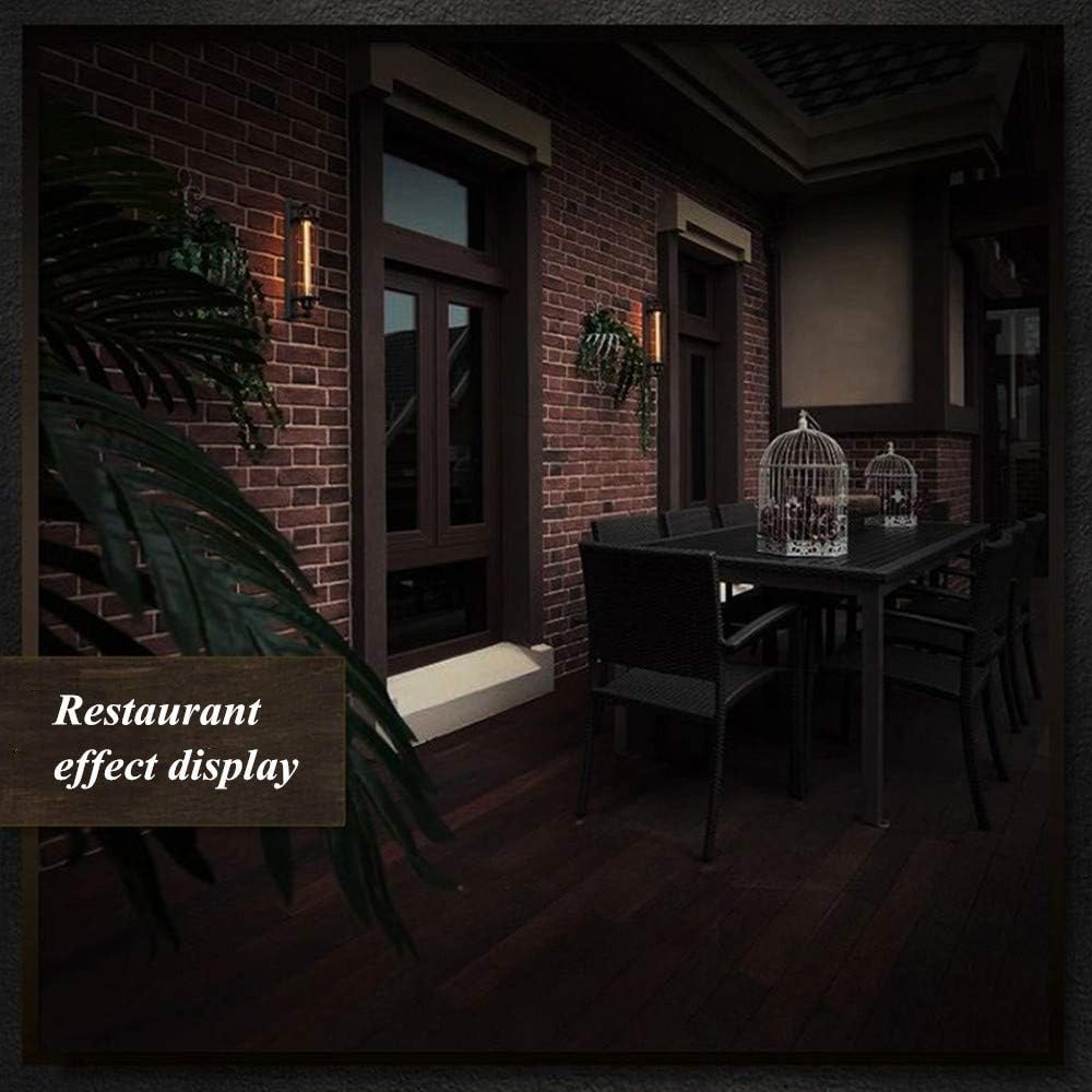 Fitlybuy matte black vintage LED wall lights mounted on a brick restaurant patio at night with ambient warm lighting.