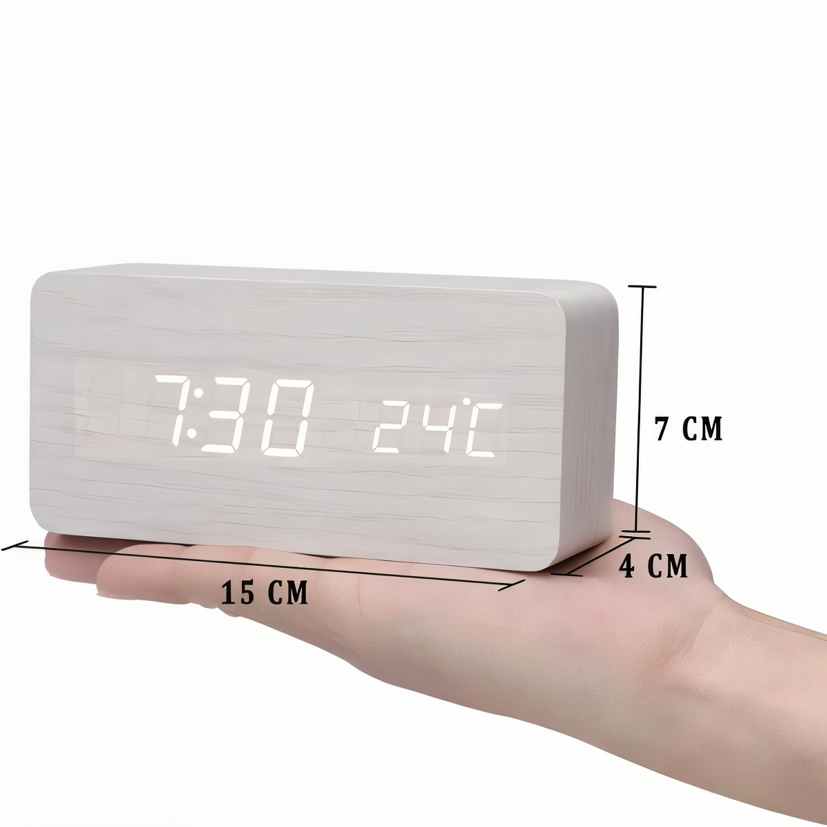White wooden LED digital alarm clock displaying time and temperature, held in hand, showing 15x7x4 cm dimensions.