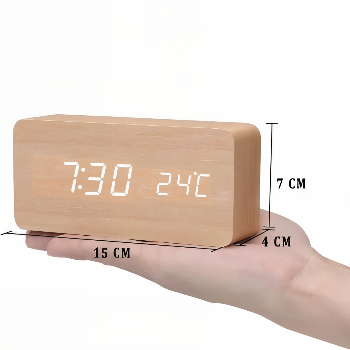 Wooden LED digital alarm clock held in hand, showing 7:30 and 24°C, with dimensions 15x7x4 cm.