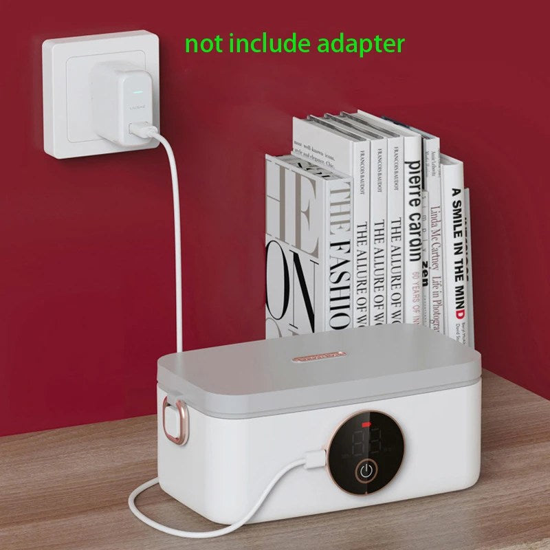Fitlybuy HeatMate Pro: A sleek white and grey electric lunchbox with a digital display, charging on a wooden desk.