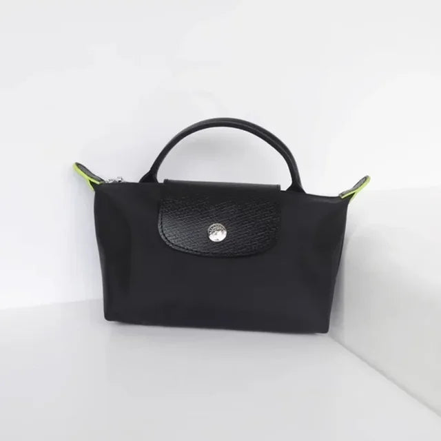 Fitlybuy Calo mini black fashion handbag with a textured flap, silver button, and neon yellow side accents.