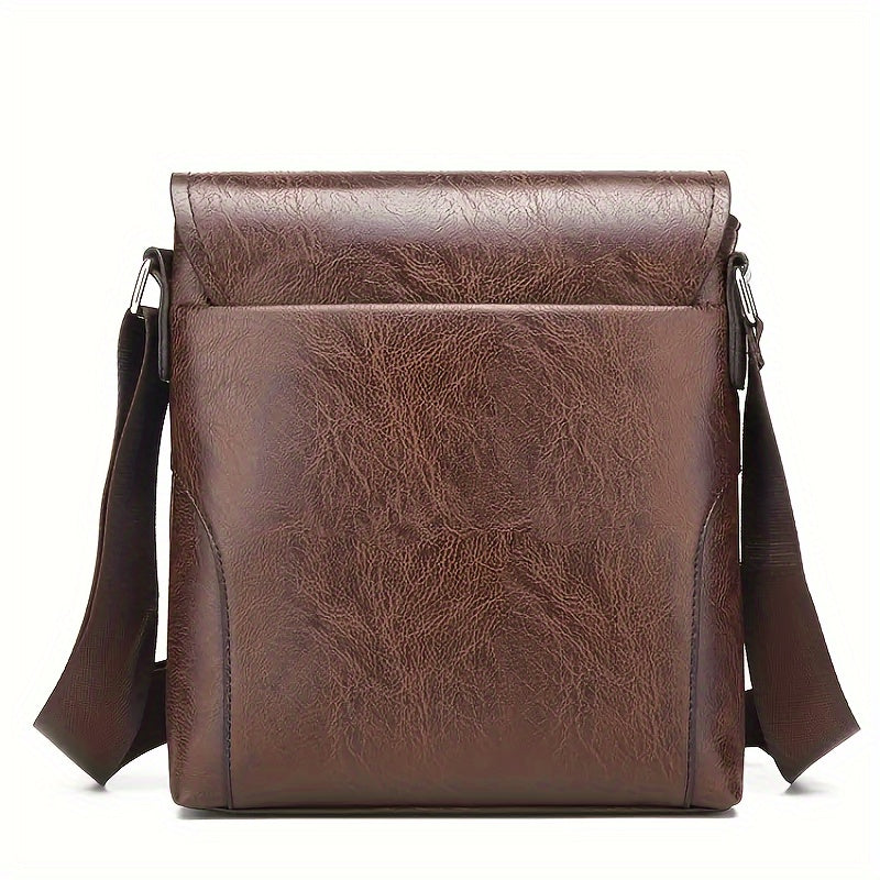 Brown vintage-style PU leather shoulder bag with a fold-over flap and adjustable shoulder strap on a white background.