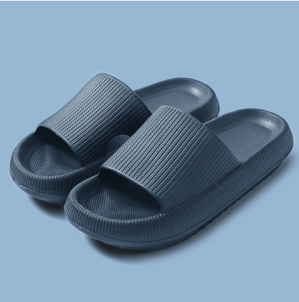 Fitlybuy navy blue cloud slippers with a thick, textured memory foam sole and wide, ribbed strap on a blue background.