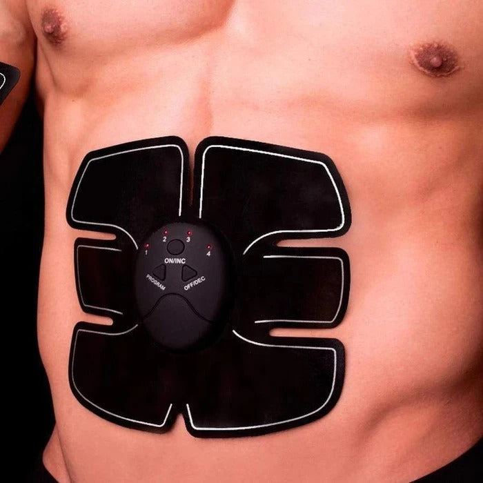 Fitlybuy black EMS abdominal muscle stimulator device attached to a man's torso with visible control buttons and lights.