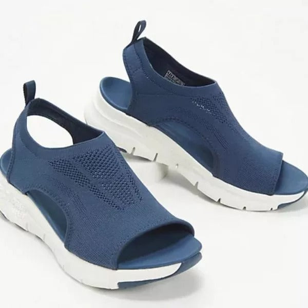 Blue orthopedic sandals with breathable mesh, open toes, slingback straps, and thick white cushioned arch support soles.