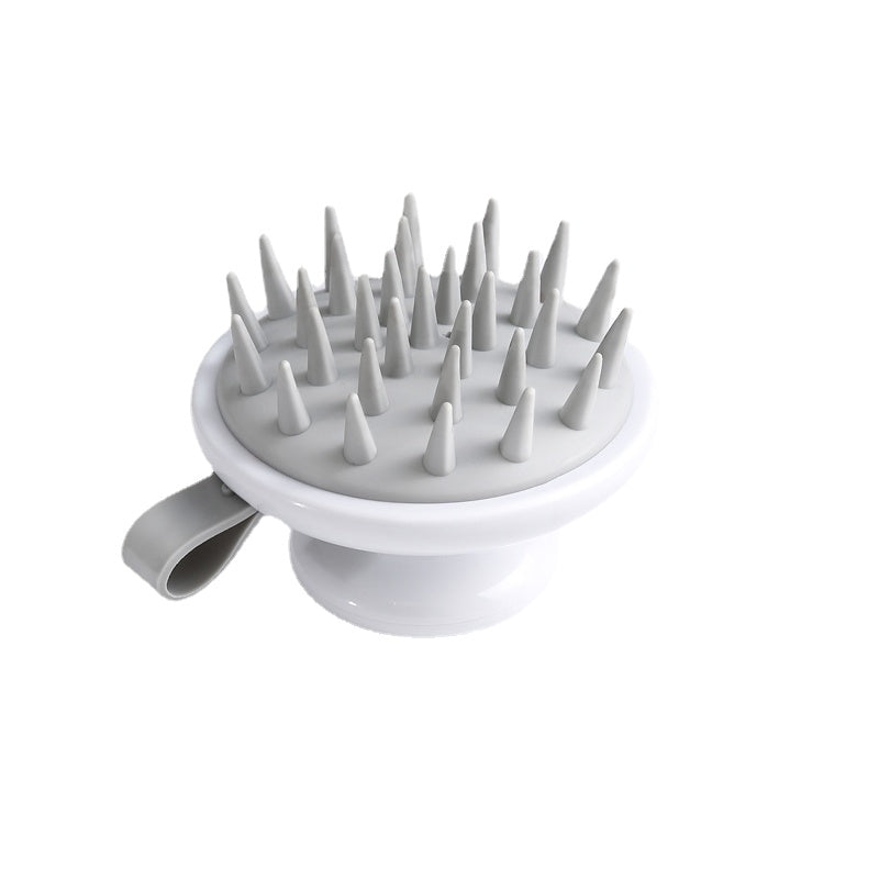 Fitlybuy Scalp Bliss Pro: A white and grey scalp massager with silicone bristles and an ergonomic comfort grip handle.