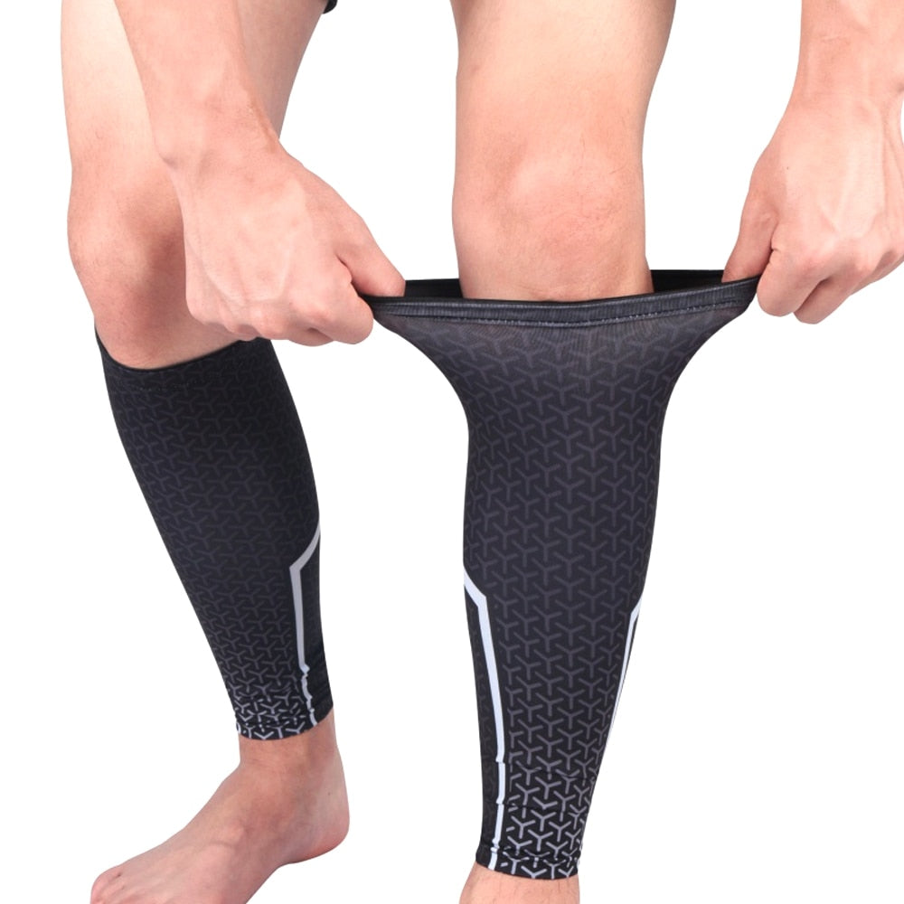 Person putting on black Fitlybuy AMS calf compression sleeve with geometric pattern and white side-stripe detailing.