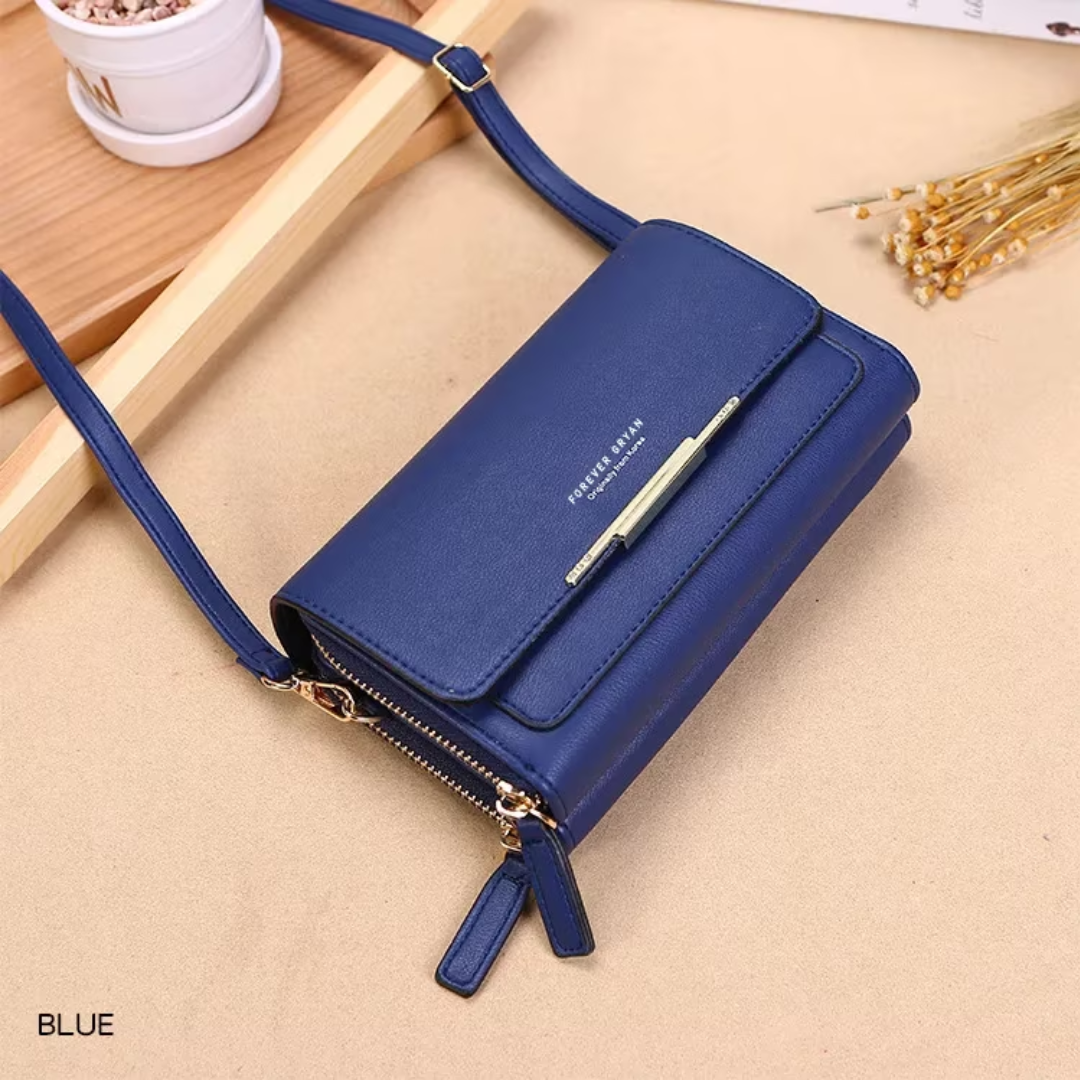 Fitlybuy premium blue leather crossbody bag with a gold-tone bar accent, dual zipper compartments, and long strap.