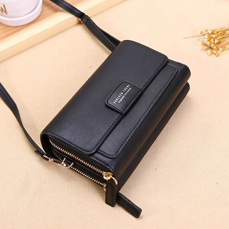 Black Fitlybuy leather crossbody bag with a flap closure, gold zipper, and adjustable strap on a neutral surface.