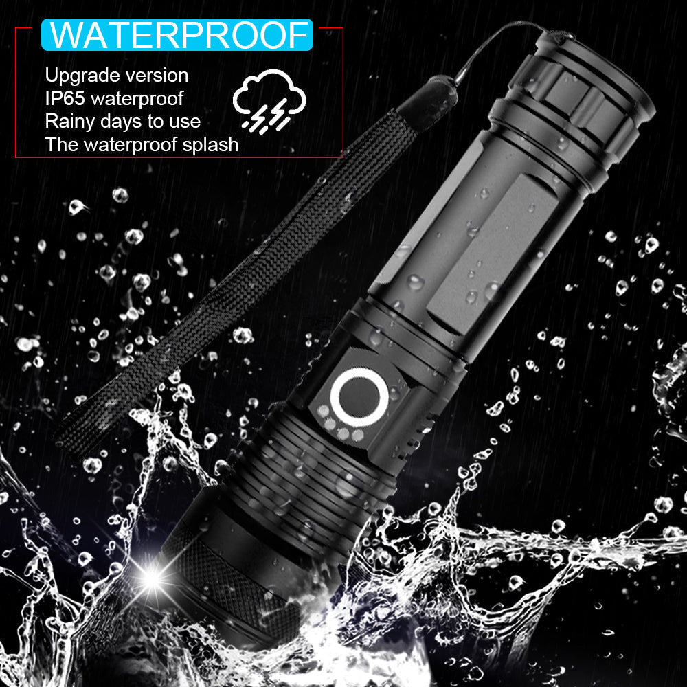 Black Fitlybuy high-power LED flashlight with wrist strap, depicted in water splashes, highlighting IP65 waterproofing.