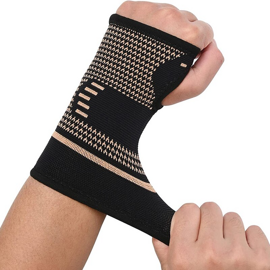 Fitlybuy black and copper compression wrist sleeve being worn on a hand, featuring heat therapy knit fabric.