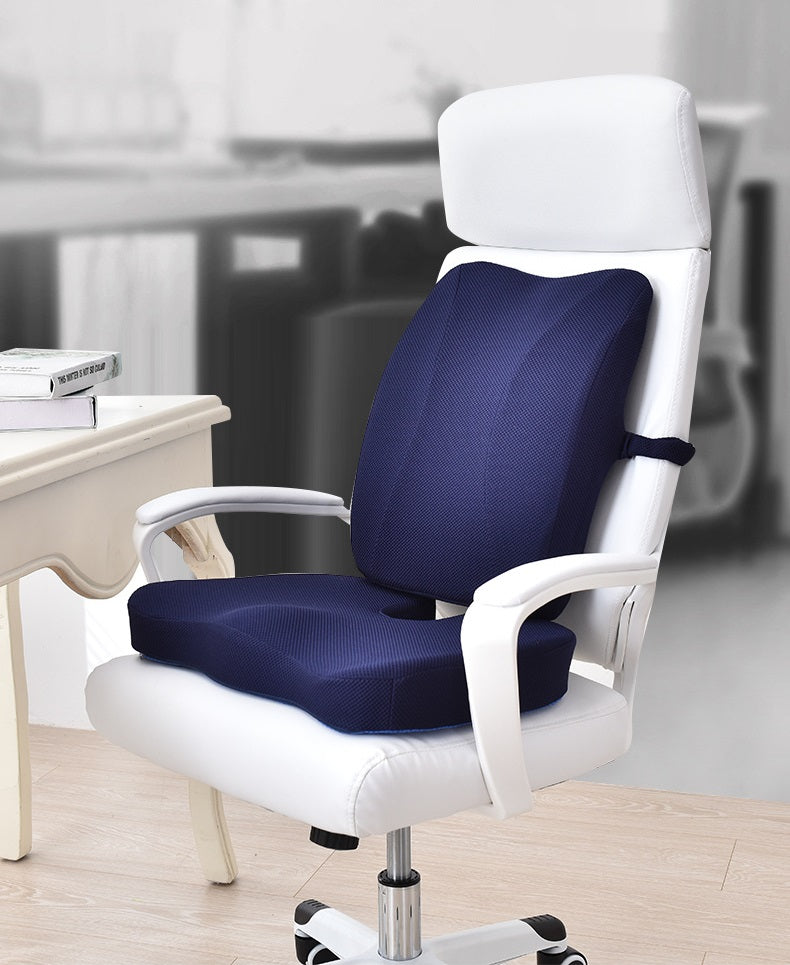 Fitlybuy blue memory foam seat and lumbar cushion set on a white office chair in a bright, modern office space.