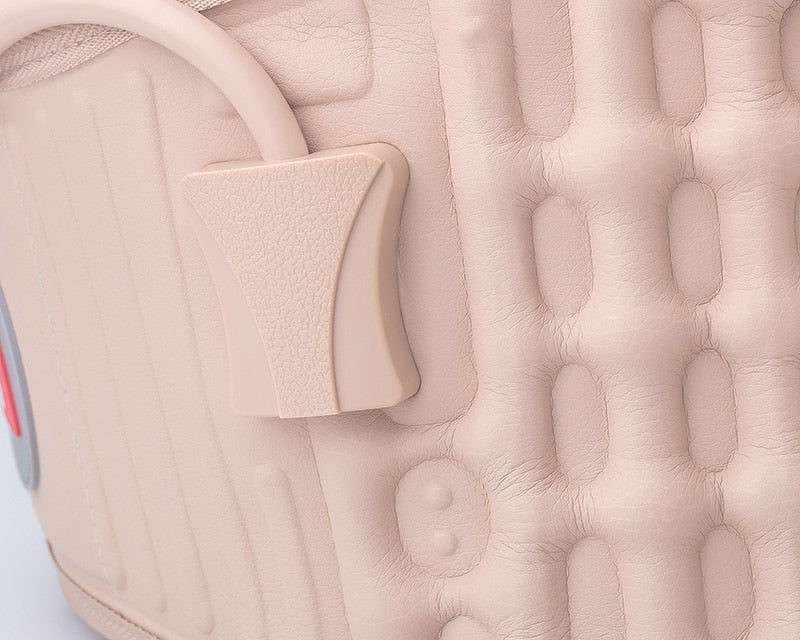 Close-up of a beige Fitlybuy decompression back belt with textured lumbar support panels and an integrated air valve.