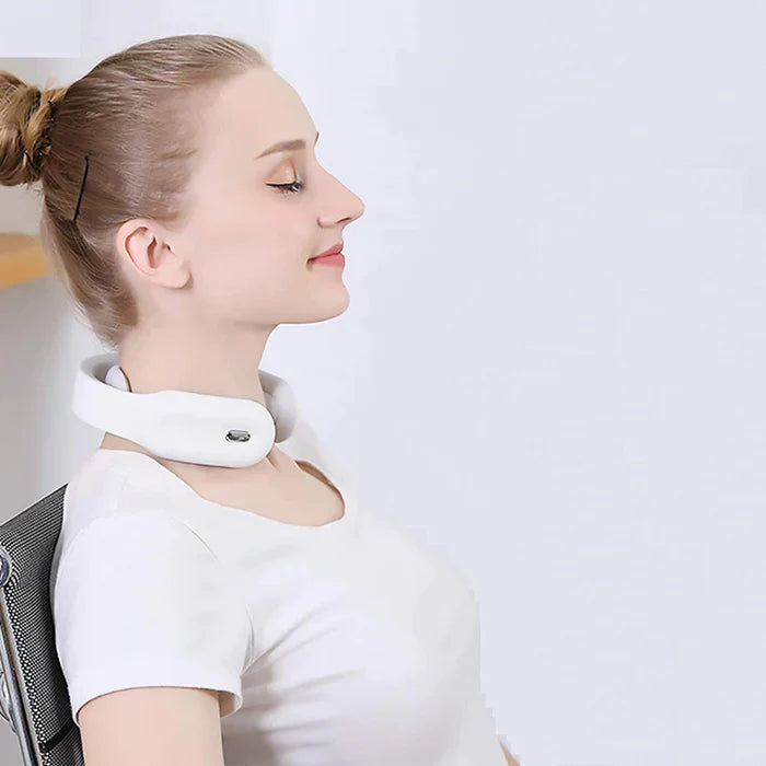 Woman wearing a white Fitlybuy smart electric neck massager with heat therapy, relaxing in a chair.