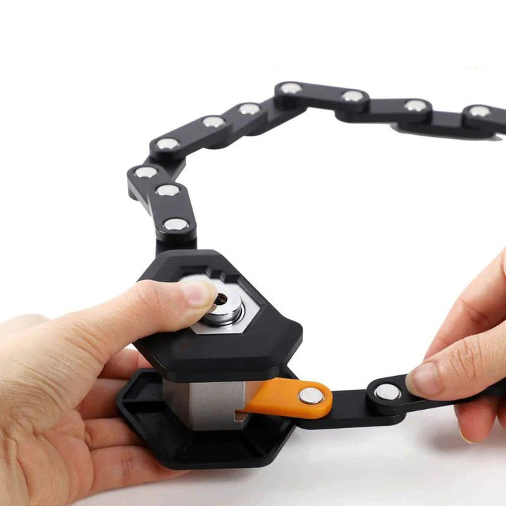 Hands locking a black, foldable heavy-duty bike chain with metal joints and an orange latch on a white background.