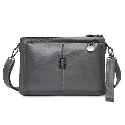 Small grey leather shoulder bag with premium finish, zipper pockets, metal detailing, and detachable strap.