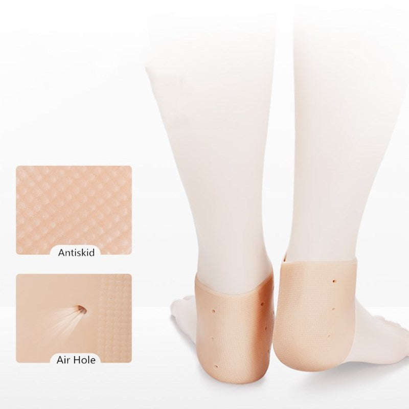 Beige silicone heel protector pads on feet, featuring antiskid texture and ventilation holes for comfort.