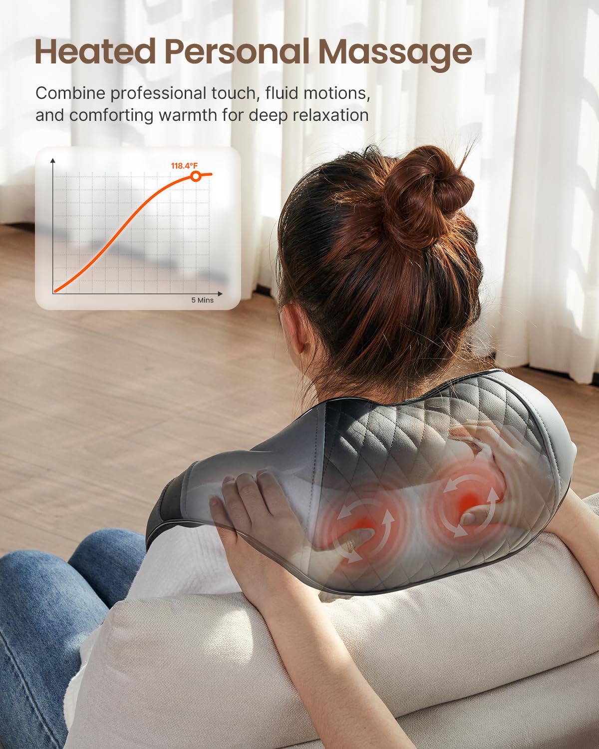 Woman using a grey Fitlybuy U-Neck 2 heated shoulder massager with quilted texture and glowing heat nodes.