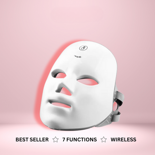 Fitlybuy white LED light therapy mask for glowing skin on a pink background, featuring wireless design and 7 functions.