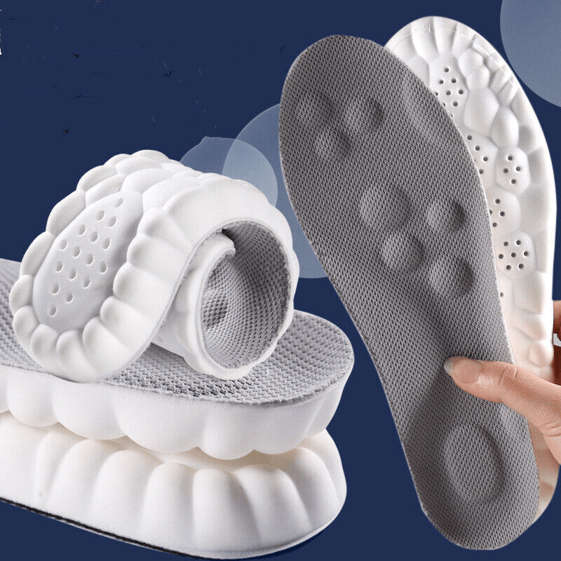 Fitlybuy AirCloud white and grey foam relief insoles with flexible ComfortWave cushioning against a blue background.