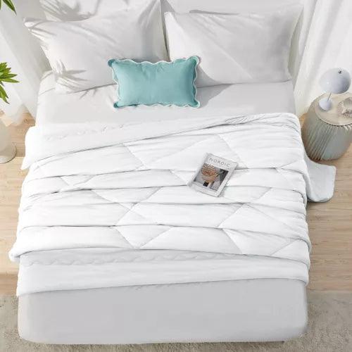 Fitlybuy white Aussie Cool Ice cooling blanket with ChillTech fabric on a white bed with a teal accent pillow.
