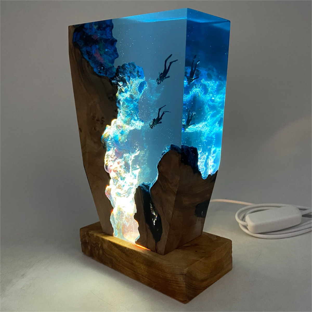 Fitlybuy handmade epoxy ocean lamp featuring a wood base, blue resin, and tiny scuba divers with SoftGlow night light.