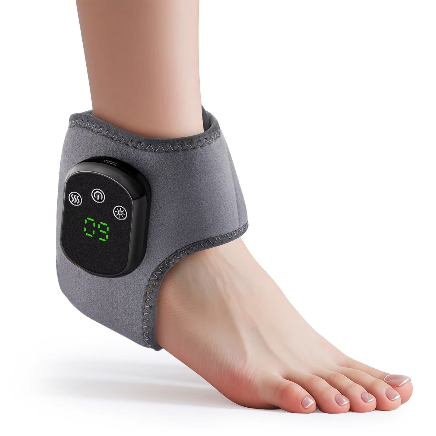 Grey electric heated ankle therapy wrap worn on a foot, featuring a digital display controller and touch-button heat.