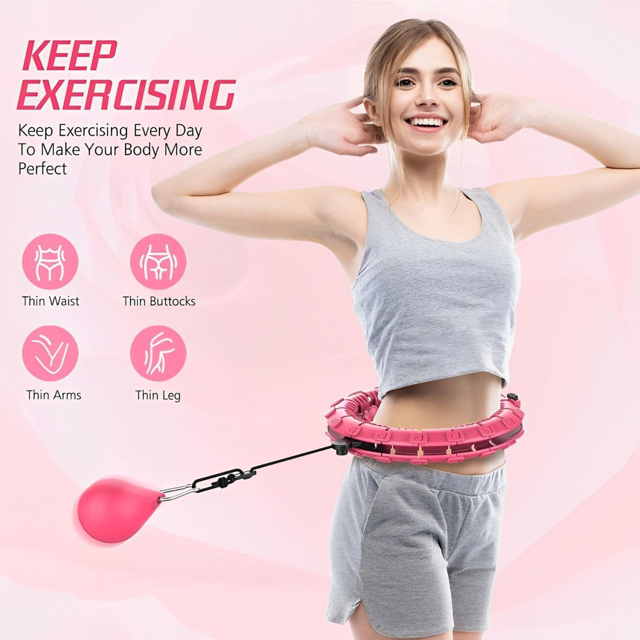 Woman smiling while using a pink Fitlybuy weighted hula hoop with resistance for core exercise.