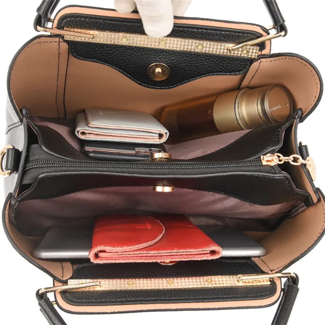 Open Fitlybuy Vivian black PU leather shoulder bag showing organized interior compartments with wallet, phone, and items.