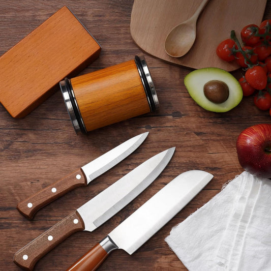 Fitlybuy wood-finish rolling knife sharpener, base, and three kitchen knives on a wooden table with fresh produce.
