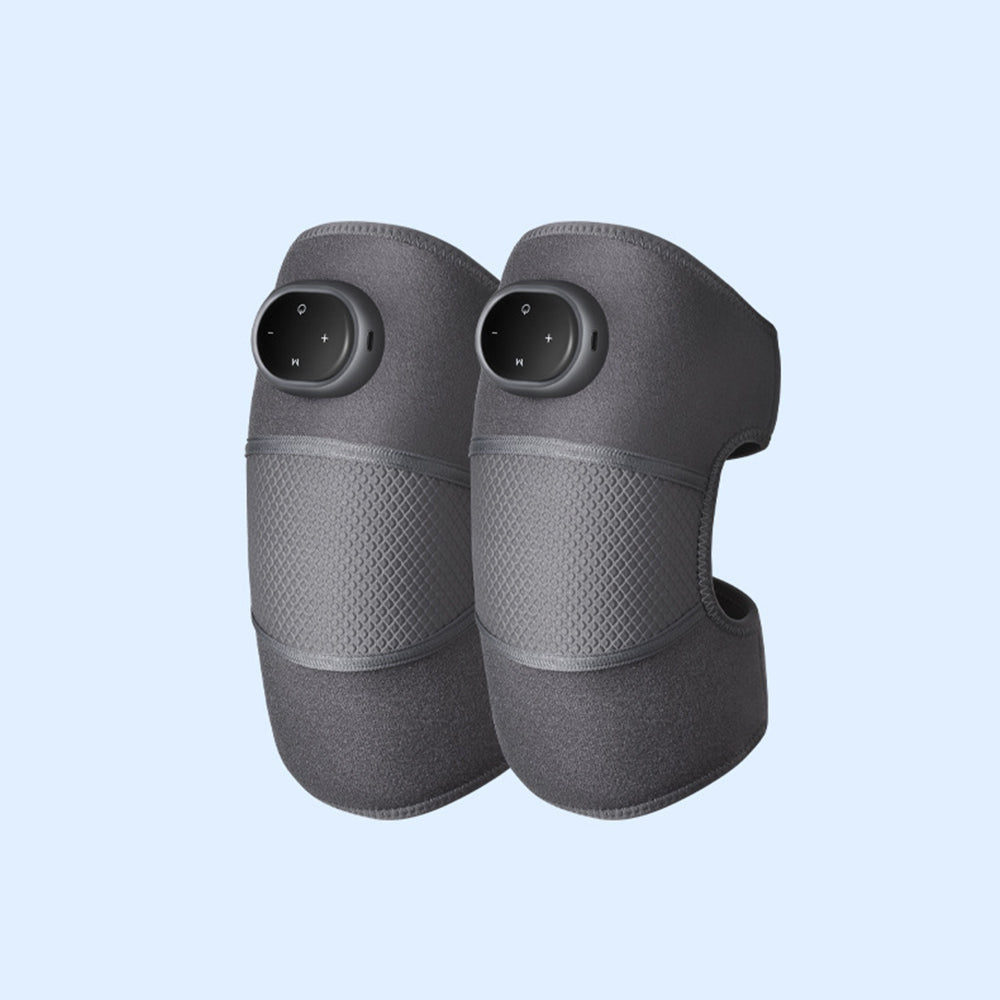 Fitlybuy SootheHeat knee massagers: a pair of dark grey, adjustable compression wraps with integrated control panels.