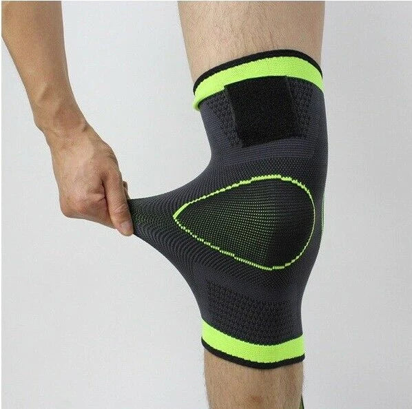 Fitlybuy gray and neon green compression knee sleeve with stretchy SupportFlex knit being stretched by a hand.