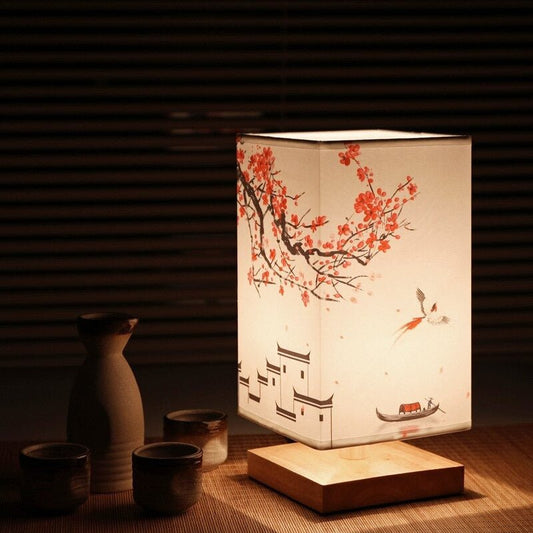 Fitlybuy Kyomi bamboo lamp with cherry blossom art, square shade, and wooden base next to tea set on bamboo mat.