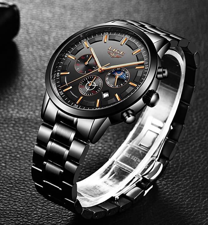 Fitlybuy VanguardTime black stainless steel military watch with chronograph subdials on a black leather background.