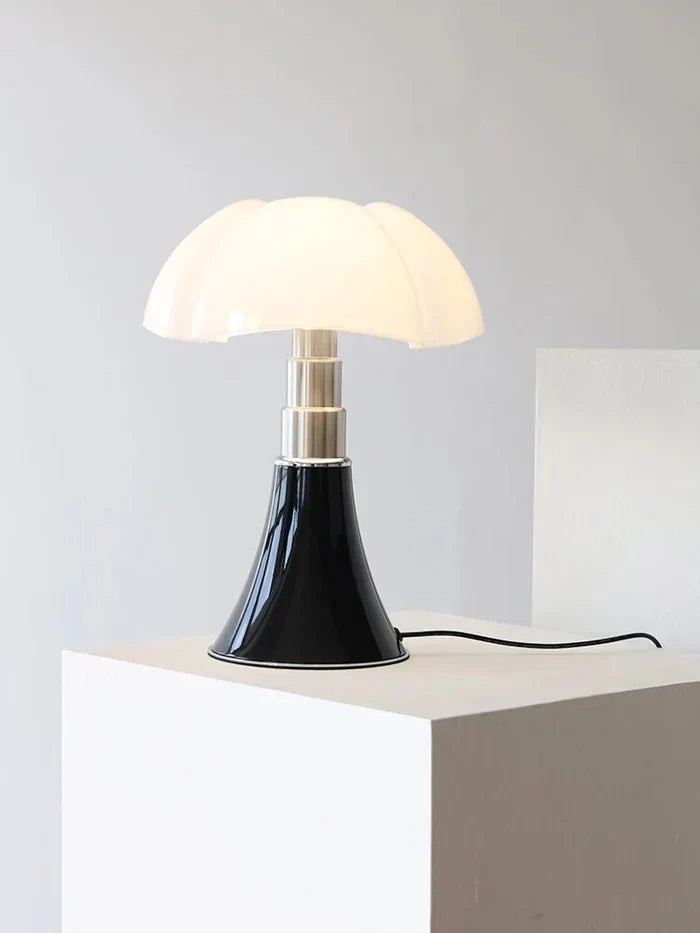 Fitlybuy FloraLuxe LED table lamp with a white floral glass shade and a glossy black base on a white pedestal.