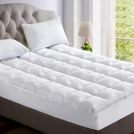Fitlybuy plush, white, tufted mattress topper with UltraSoft comfort, shown on a bed in a bright, modern bedroom.
