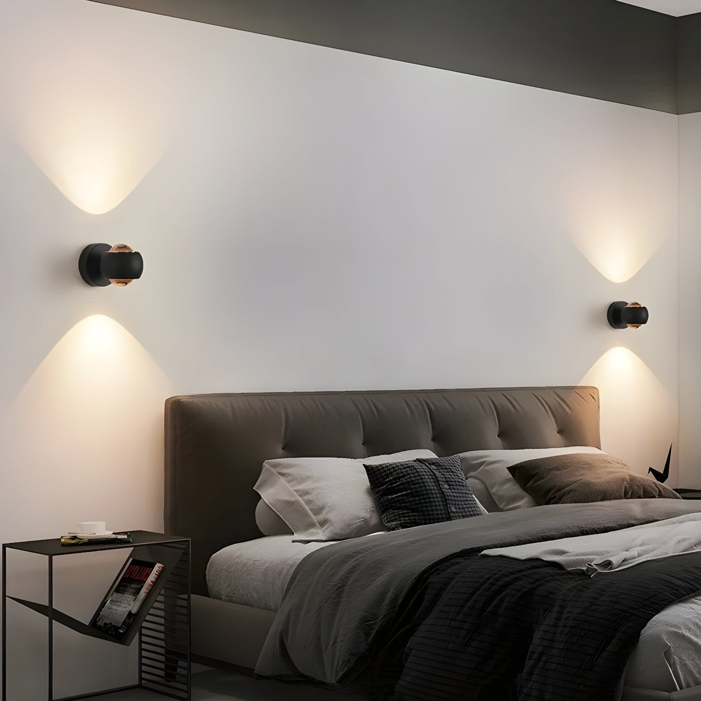 Fitlybuy ModernEdge rotating black wall lights with warm LED up-down lighting installed in a modern bedroom.