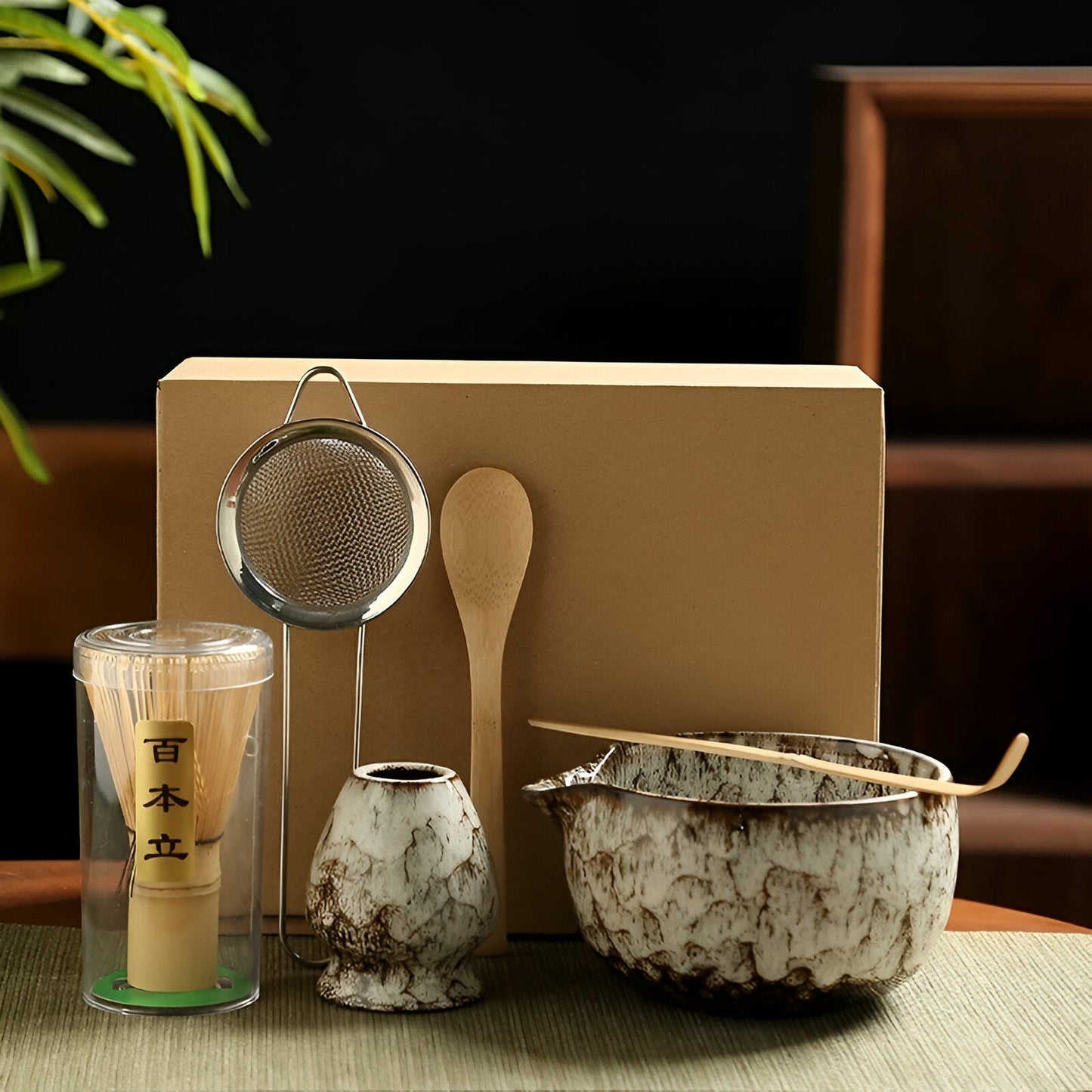 Fitlybuy 6-piece Japanese matcha set with ceramic bowl, whisk, scoop, holder, and strainer in front of a gift box.