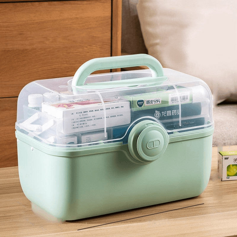 Fitlybuy light green, portable medicine storage box with a clear lid and carry handle, filled with medication boxes.