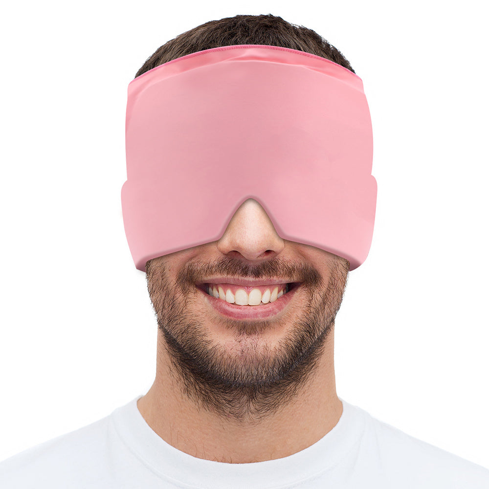 Man wearing a pink Fitlybuy migraine relief headband with ComfortWave technology over his eyes and forehead.