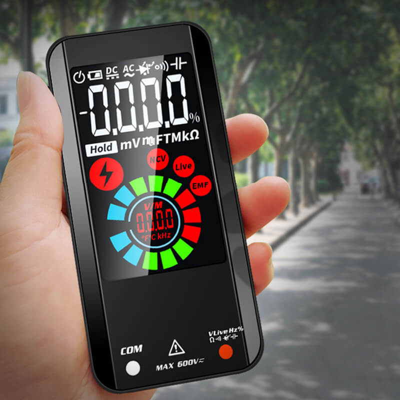Hand holding a sleek, black Fitlybuy digital multimeter with a colorful, high-precision illuminated touchscreen display.