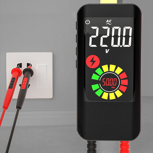 Fitlybuy smart digital multimeter showing 220V reading, with probes testing a wall outlet to measure voltage and Hz.