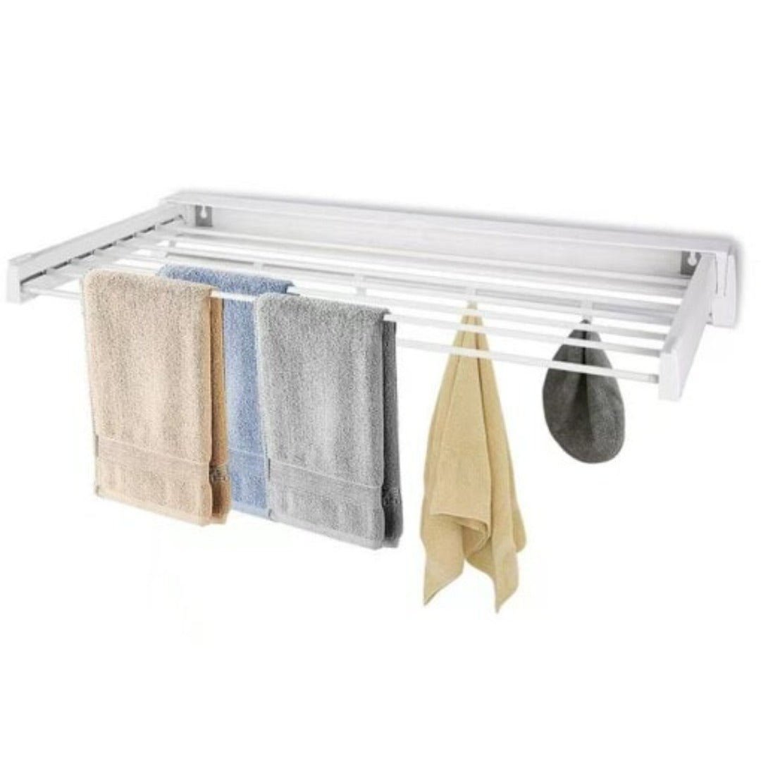 White, foldable wall-mounted laundry drying rack holding several towels and cloths.