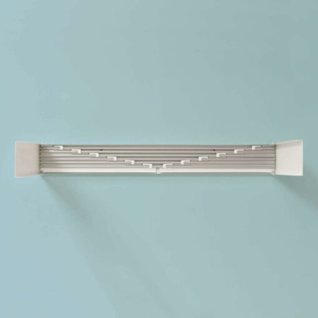 Fitlybuy grey and white foldable wall-mounted laundry drying rack with a compact, space-saving design on a blue wall.