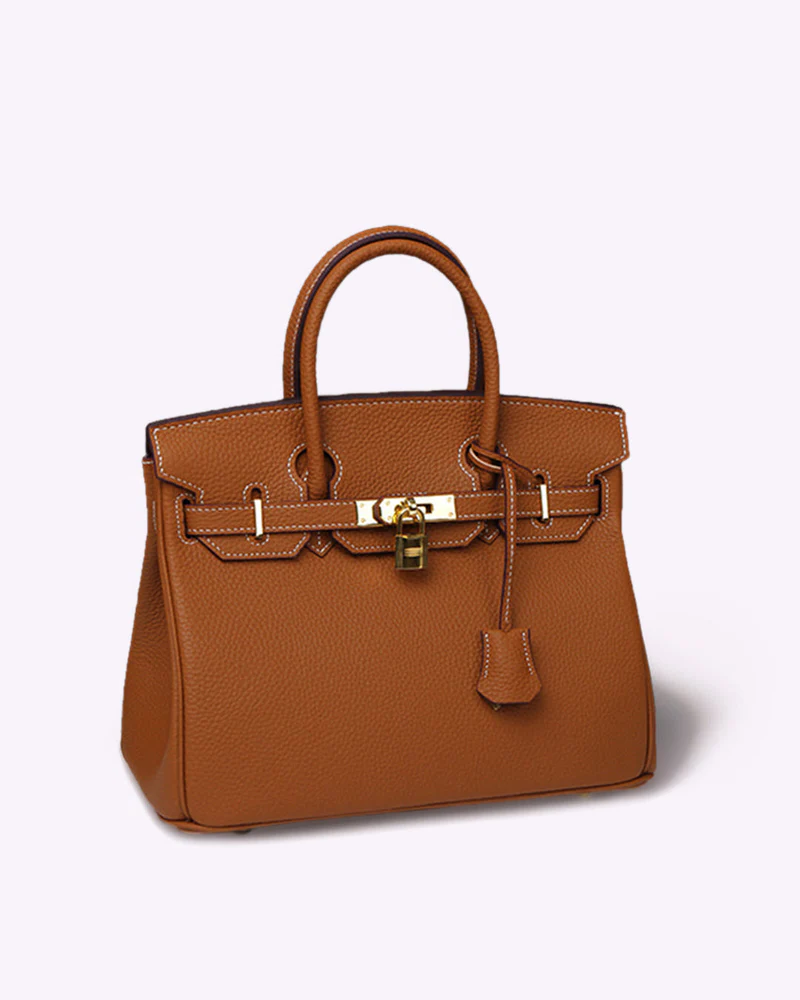 Tan pebbled leather Fitlybuy LuxeCarry handbag with gold hardware, top handles, and a decorative padlock on a white bg.