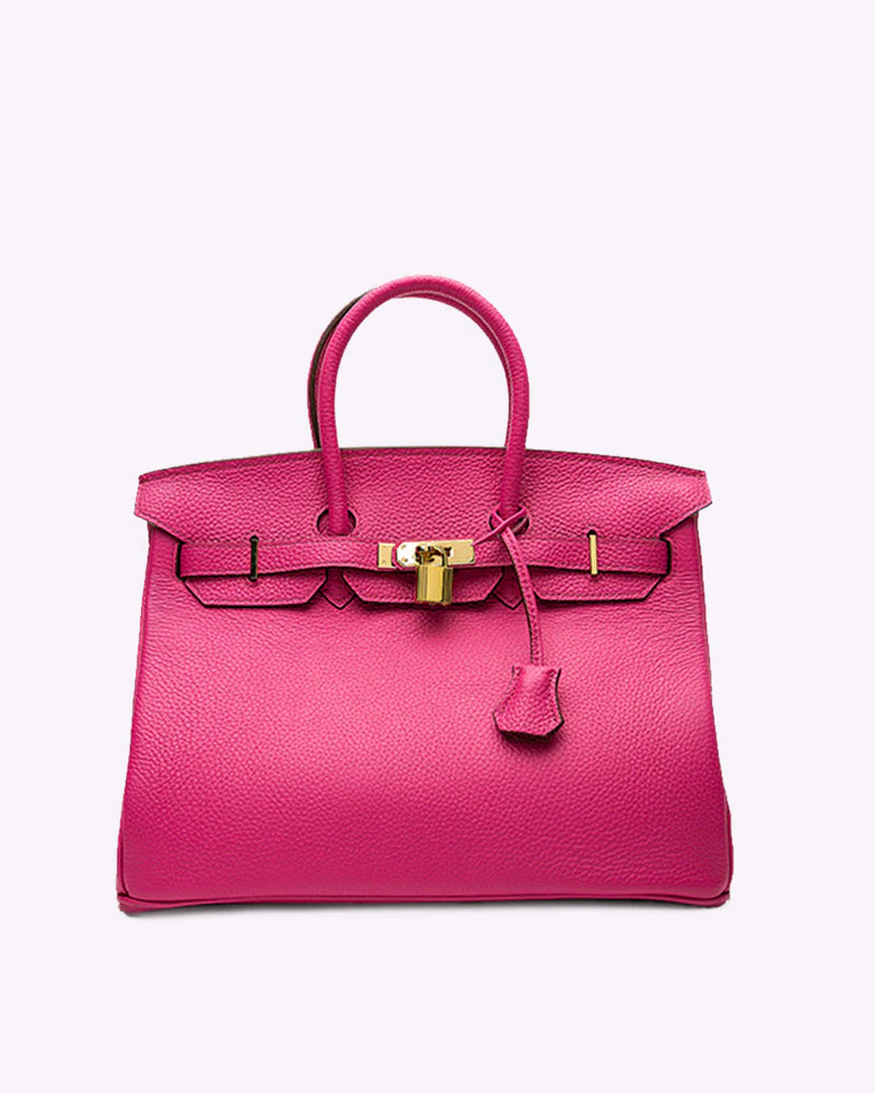 Hot pink Fitlybuy LuxeCarry pebbled leather handbag with gold hardware, top handles, and a central padlock closure.