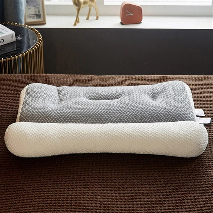 Fitlybuy ergonomic foam pillow in gray and white with a contoured design, resting on a brown textured bedspread.