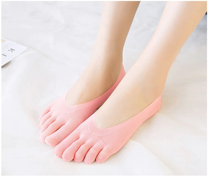 Pair of light pink Fitlybuy compression toe socks with textured arch support worn on feet against a white background.