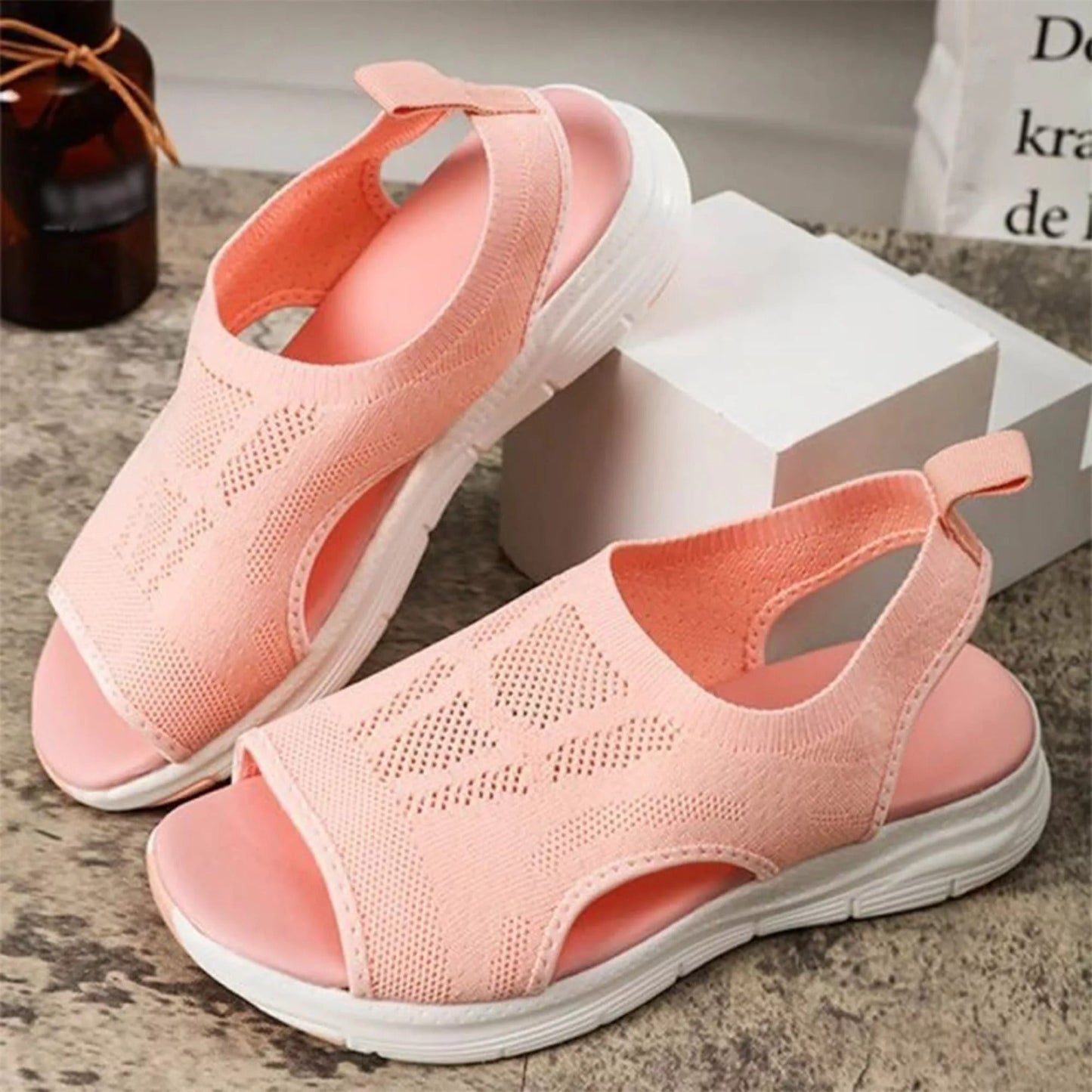 Fitlybuy peach orthopedic sandals with breathable knit mesh, cushioned soles, and white traction outsoles.