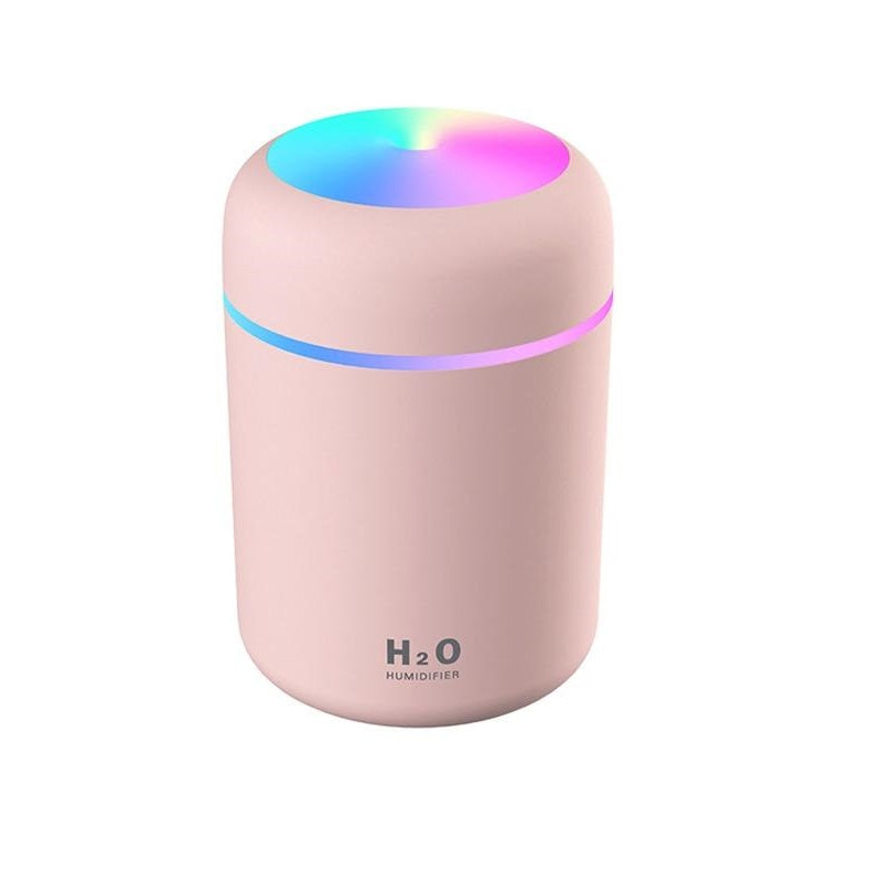 Pink portable Fitlybuy aroma diffuser with multicolor LED ring light and H2O Humidifier label on white background.